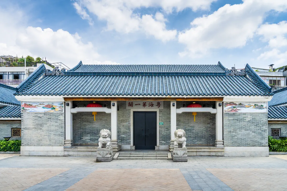 Traditional Qing Dynasty Yuehai Customs First Guard Memorial Hall with stone lions and colourful roof mouldings