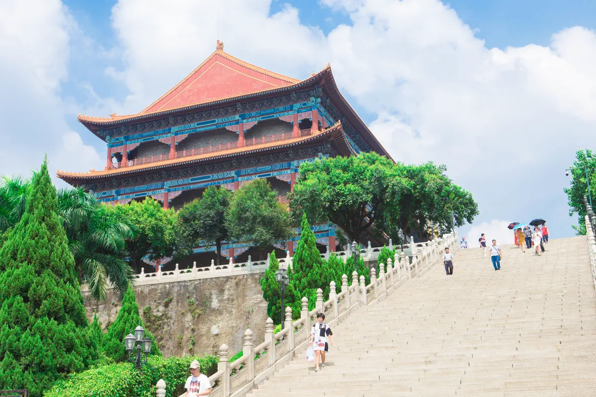 The multi-tiered Guanyin Pavilion fronted by a wide white marble staircase and verdant pines