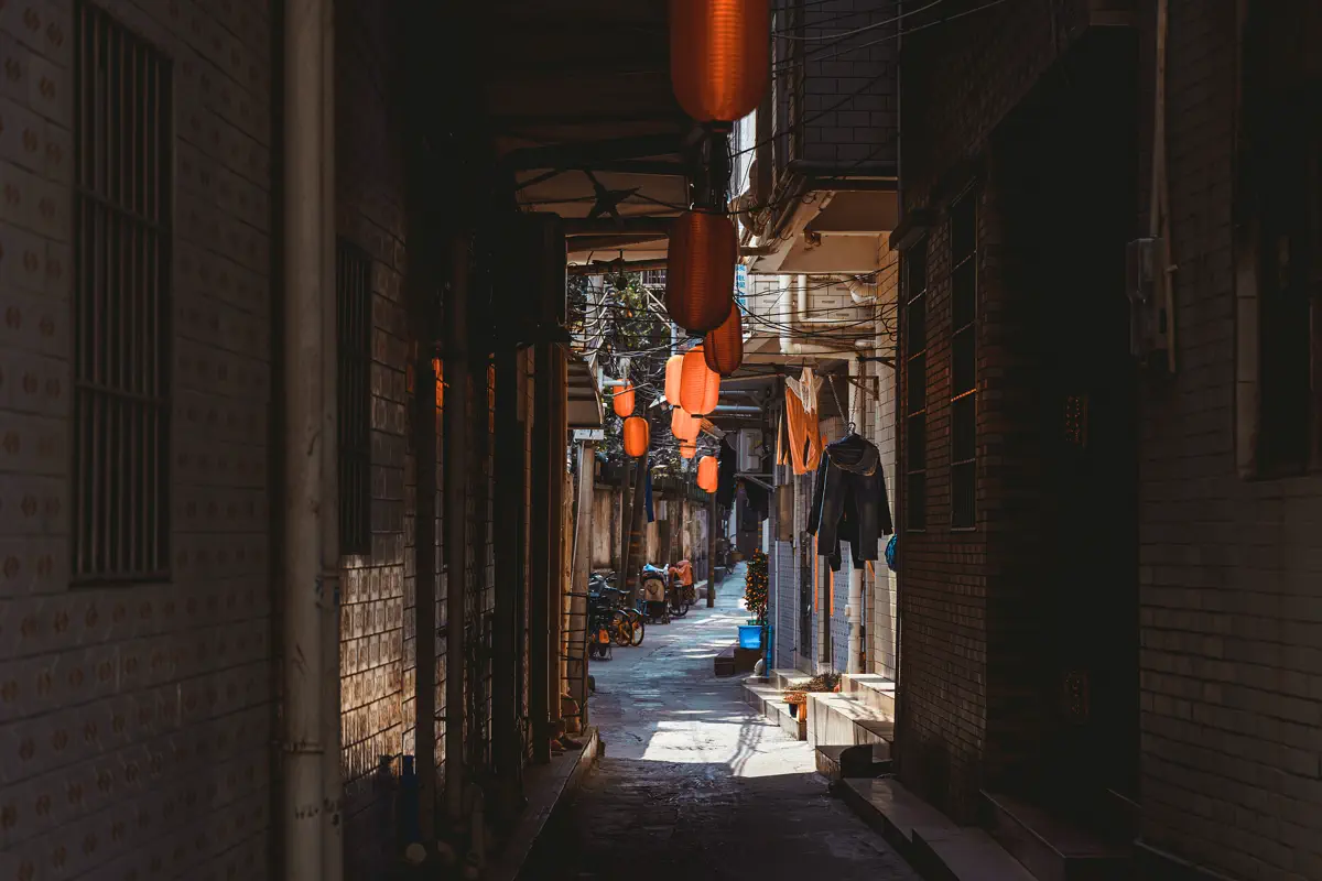 Quiet flagstone alley decorated with red lanterns in Shenjing Ancient Village