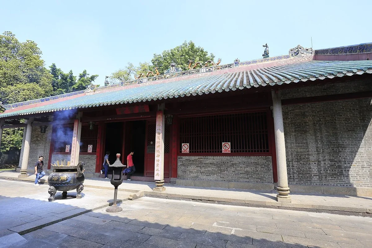 Rear Zhaoling Palace with ancient incense cauldron beneath green glazed tiles and clear daytime skies